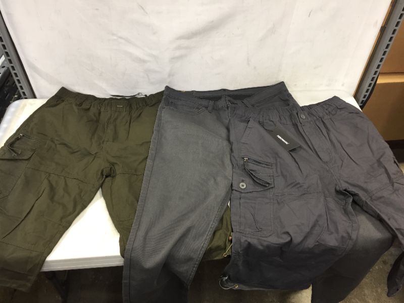 Photo 1 of 3 pack - Mens Bottoms 3XL , 36x30 Dark Colors, SOLD AS IS