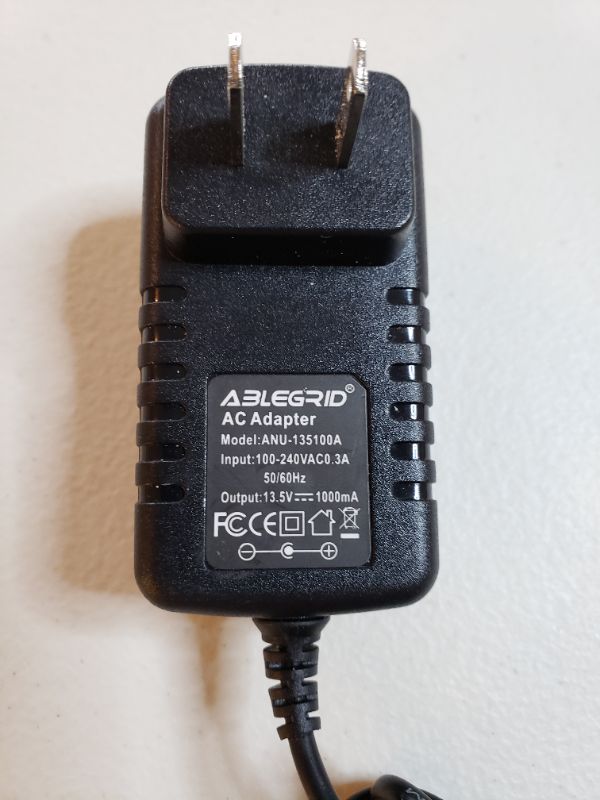 Photo 2 of AC Adapter Model: ANU-135100A, 13.5V.