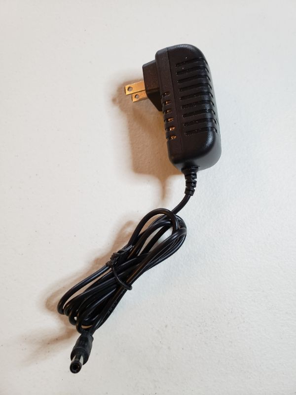 Photo 1 of AC Adapter Model: ANU-135100A, 13.5V.