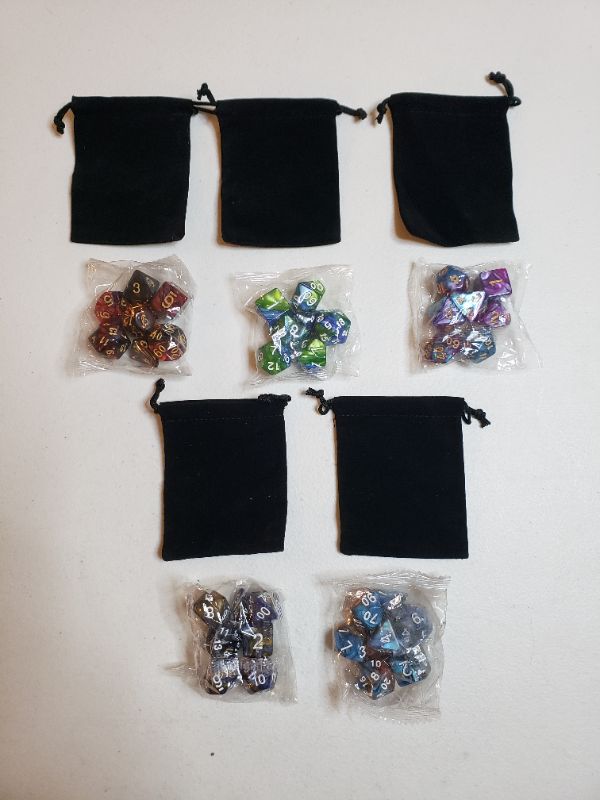 Photo 1 of 5 SETS OF GAME DICE WITH CARRYING BAGS.