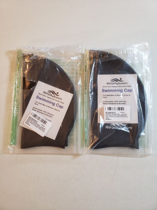 Photo 1 of SWIMMING CAPS, LOT OF 2 PACKAGES. BLACK.