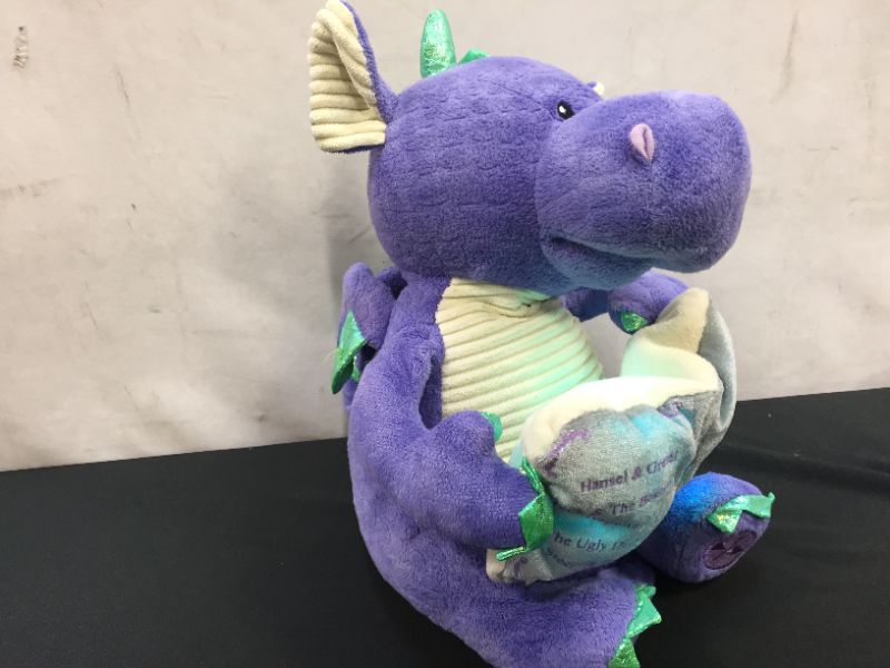 Photo 1 of Cuddle Barn | Dalton the Storytelling Dragon 12" Animated Stuffed Animal Plush Toy | Mouth Moves, Head Sways and Book Lights Up | Recites 5 Fairy-Tales
