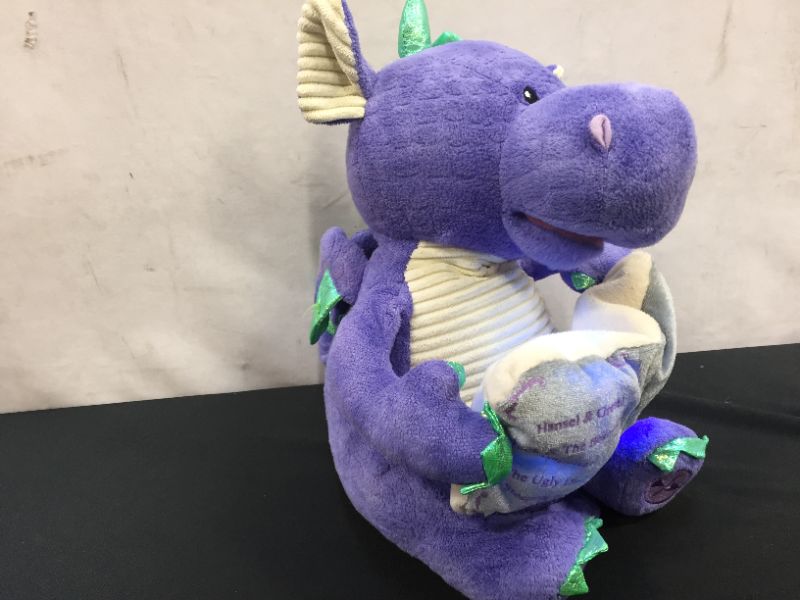 Photo 1 of Cuddle Barn | Dalton the Storytelling Dragon 12" Animated Stuffed Animal Plush Toy | Mouth Moves, Head Sways and Book Lights Up | Recites 5 Fairy-Tales
