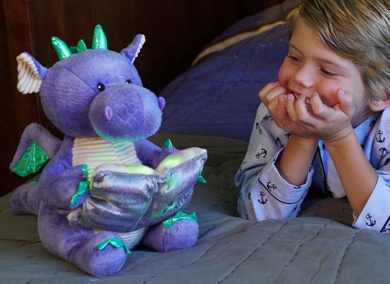 Photo 1 of Cuddle Barn | Dalton the Storytelling Dragon 12" Animated Stuffed Animal Plush Toy | Mouth Moves, Head Sways and Book Lights Up | Recites 5 Fairy-Tales
