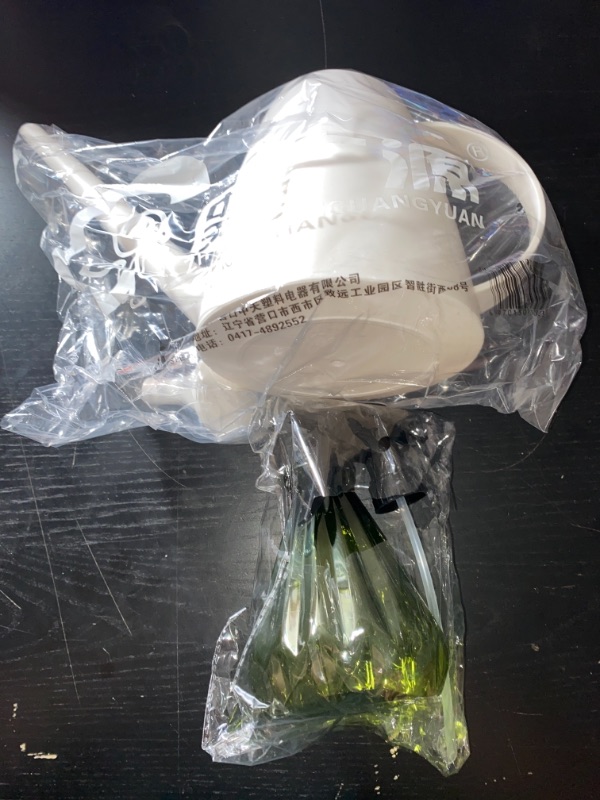 Photo 1 of indoor watering can and spray bottle
