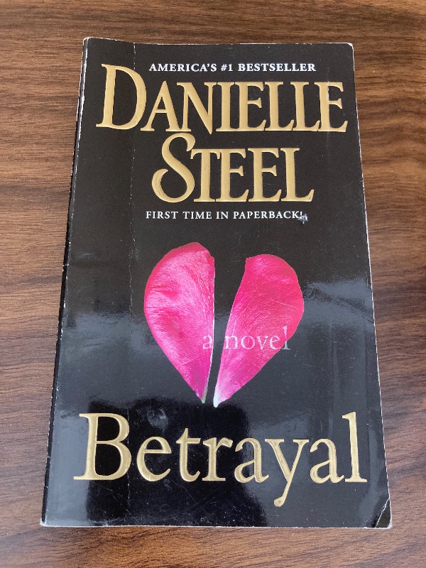 Photo 1 of Betrayal: A Novel Mass Market Paperback – January 29, 2013