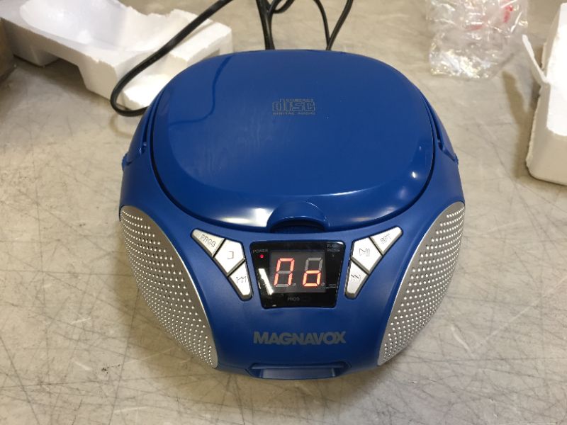 Photo 2 of Magnavox MD6924-BL Portable Top Loading CD Boombox with AM/FM Stereo Radio in Blue | CD-R/CD-RW Compatible | LED Display | AUX Port Supported | Programmable CD Player |
