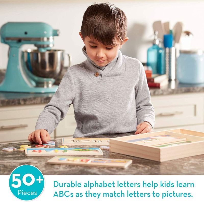 Photo 1 of Melissa & Doug See & Spell Wooden Educational Toy With 8 Double-Sided Spelling Boards and 64 Letters
