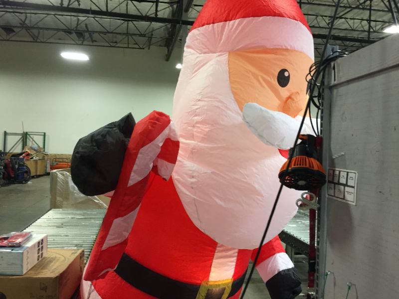 Photo 4 of 11 ft. Airblown Santa with Candy Cane Christmas Inflatable