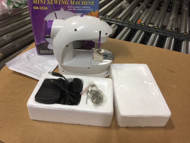 Photo 1 of mini sewing machine sm-202a