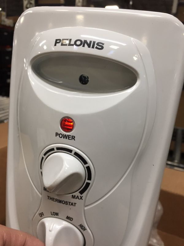 Photo 3 of PELONIS HO-0201 Portable Radiator Heater with 3 Heat Settings
