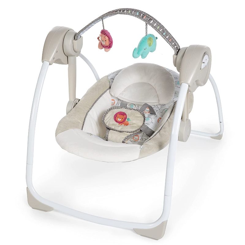 Photo 1 of Ingenuity Soothe 'n Delight 6-Speed Compact Portable Baby Swing with Music and Toy Bar - Cozy Kingdom
