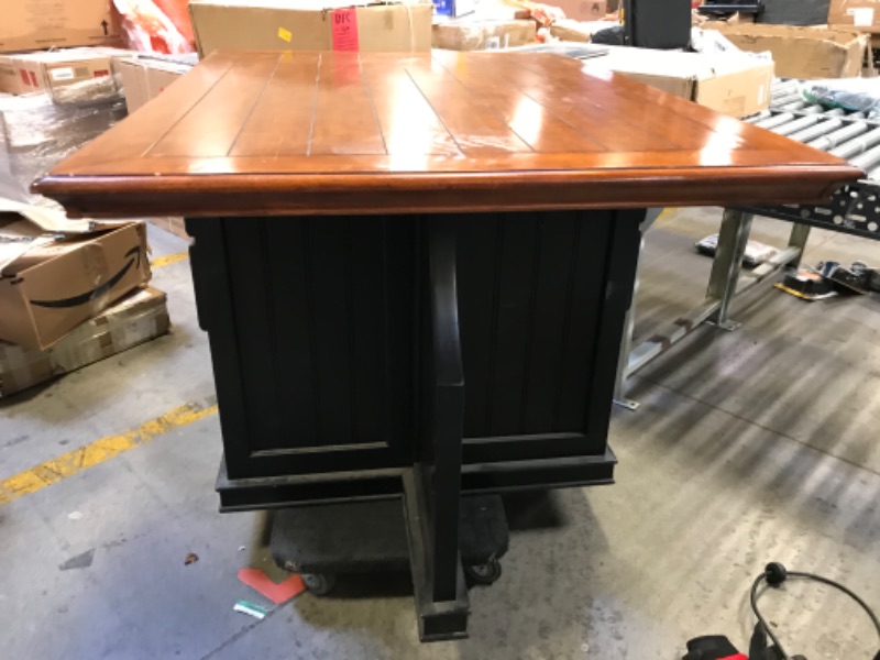 Photo 5 of 54in W X 40in D X 36in H 4 SEATER TABLE WOODEN. DARK WOOD STAIN TOP WITH BROWN BLACK PAINTED BOTTOM.  2 DRAWERS WITH SMALL CUBBY ON 2 SIDES. WITH SPLIT ON THE OTHER 2