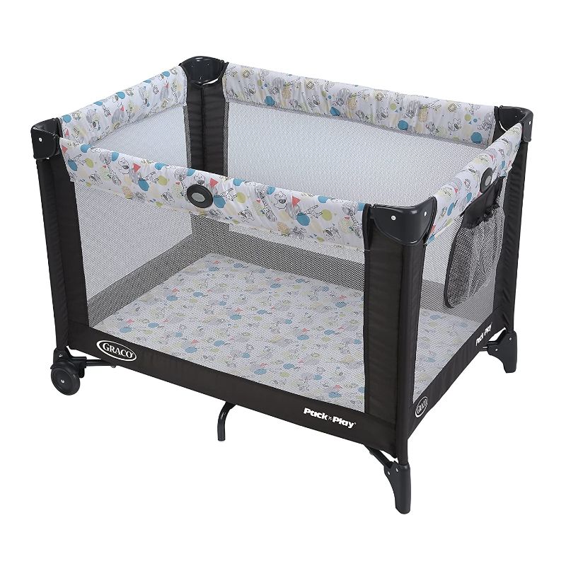 Photo 1 of Graco Pack and Play Portable Playard, Push Button Compact Fold, Carnival--rip in fabric
