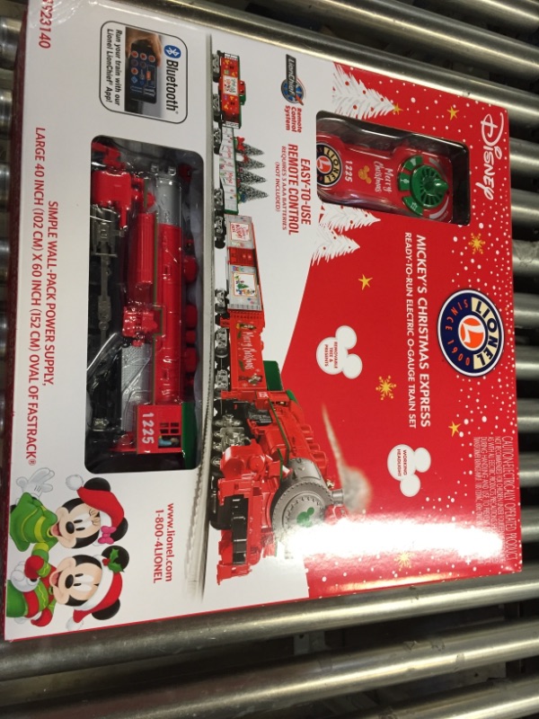 Photo 4 of Lionel Disney Christmas LionChief 0-8-0 Set with Bluetooth Capability, Electric O Gauge Model Train Set with Remote
