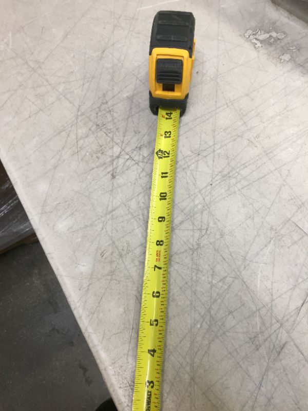 Photo 1 of 30 ft. x 1-1/8 in. Tape Measure--locking mechanism does not work 

