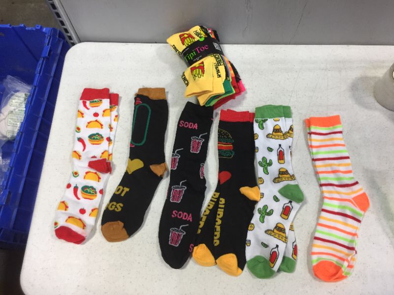 Photo 1 of Assorted novelty socks sizes 5-9 12 PK