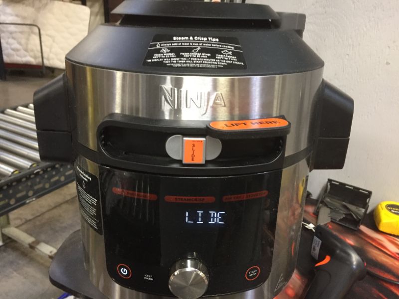 Photo 2 of Ninja OL701 Foodi SMART XL 8 Qt. Pressure Cooker Steam Fryer with SmartLid & Thermometer + Auto-Steam Release, 14-in-1 that Air Fries, Bakes & More, 3-Layer Capacity, 5 Qt. Crisp Basket, Silver/Black
