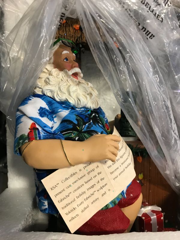 Photo 3 of Kurt Adler 11-Inch Fabriché™ Beach Santa Sitting At Tiki Bar
