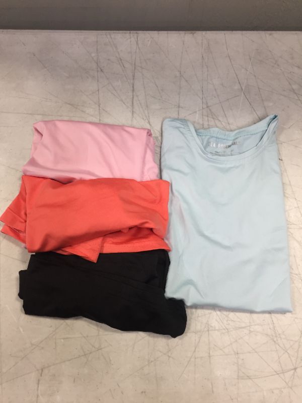 Photo 1 of Girls Medium athletic shirts 4pack