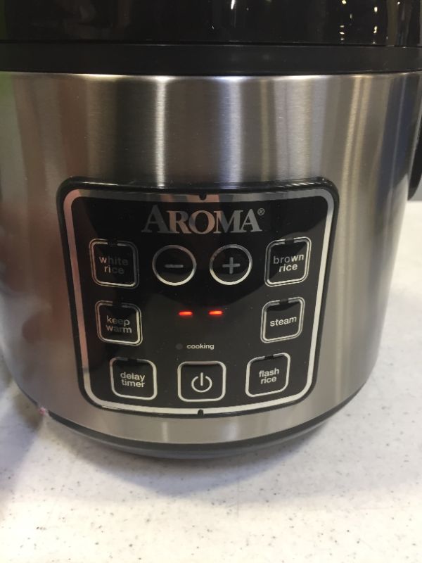 Photo 2 of Aroma Digital Rice Cooker and Food Steamer, Silver, 8 Cup---- POWERS ON/UNABLE TO TEST FOR FULL FUNCTIONALITY (DENT ON SIDE SHOW IN PICTURE) 