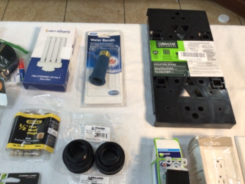Photo 2 of Bundle of Assorted Hardware Store Items Wall Plates for Electrical Outlets, Wall Switches, Dewalt Rotary Rasp Bit, Mouse Trap, Drill Bits, Drawer Handles, Window Latches, Mailbox Mounting Board, Water Bandit, Door Handle many more items.