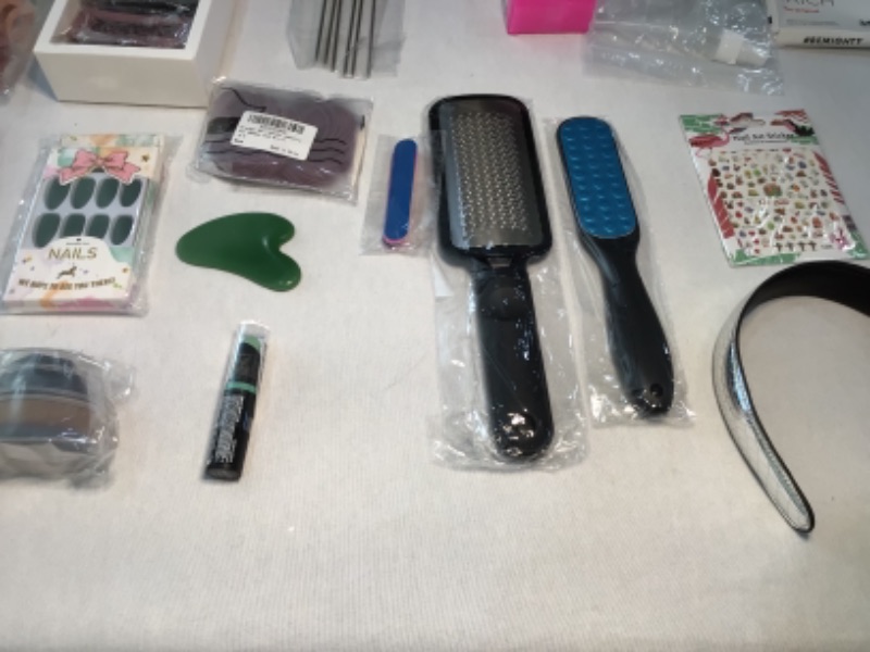 Photo 1 of Bundle of Assorted Women's Beauty Products-See photos-Hair Clips, Slant Tweezer, Small Wire Mesh Rollers, Foundation MakeUp Brush, Lipstick BlueGreen, Green Facial Rock, Nails Green, Hair Ties, Combs, Hair Bands, Nail Art Stickers, Spray Bottles, Foot Ras