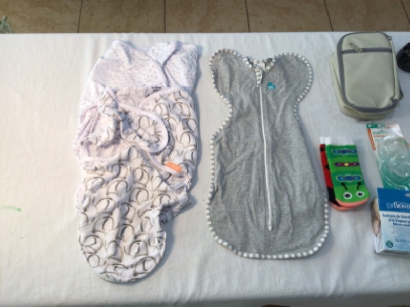 Photo 1 of Bundle of Assorted items for Babies-2 Swaddle Cloths, 1 Onesie (newborn), Milk Sterilization bags, 2 Pacifiers, teething ring
Socks, Stove Knob Covers, Corner Cushions, 2 Sippy Cups, One cup
