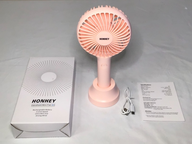 Photo 1 of HonHey Handheld Fan Portable, Mini Hand Held Fan with USB Rechargeable Battery, 3 Speed Personal Desk Table Fan with Base, 8-12 Hours Operated Small Makeup Eyelash Fan for Women Girls Kids Outdoor- Color Pink