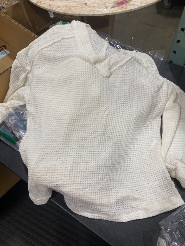 Photo 1 of white knitted blouse, unknown size possibly a large