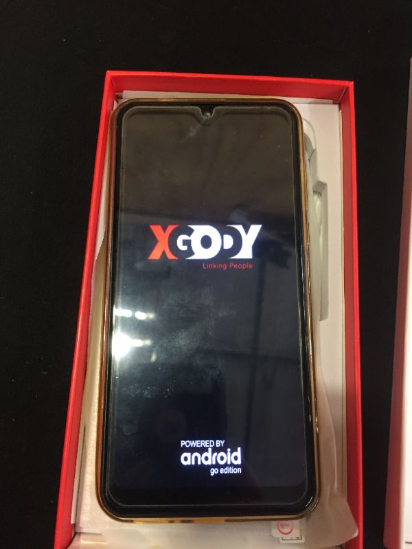 Photo 1 of generic xgody phone---- does not come with charger screen is blacked out at top 