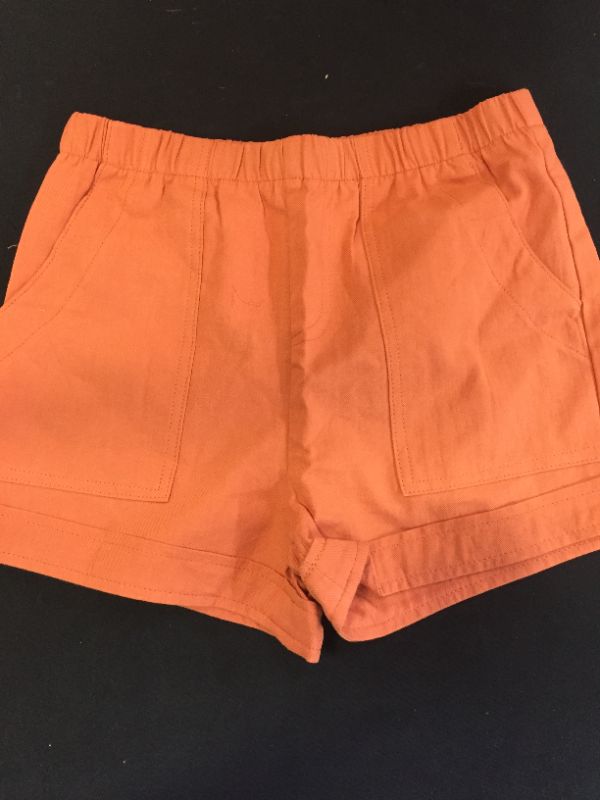 Photo 1 of GIRLS ORANGE SHORTS SIZE MEDIUM 