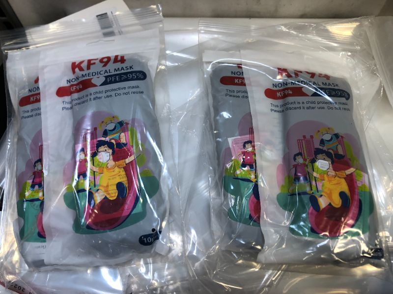 Photo 1 of 4 packs of kids masks 