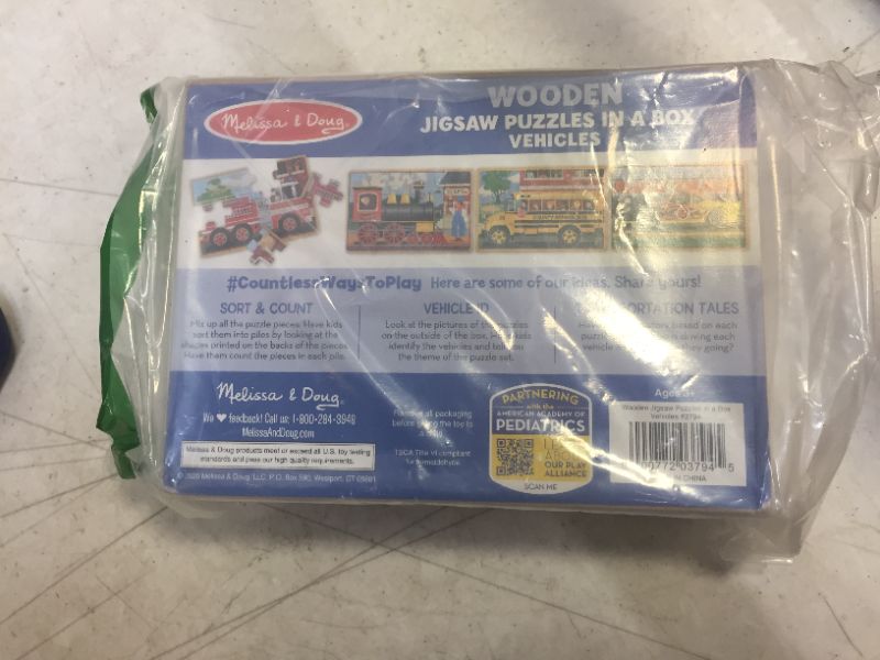 Photo 1 of Melissa & Doug Vehicles 4-in-1 Wooden Jigsaw Puzzles in a Storage Box (48 pcs)