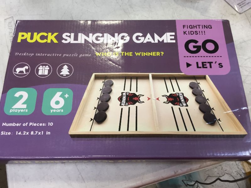 Photo 2 of Fast Sling Puck Game, Sling Games Fast Sling Puck Table Game Paced Sling Puck Winner Wood Board Sport Toys (Small Size Suitable for Kids Child & Family), Come with Spare Piece and Spring Rope