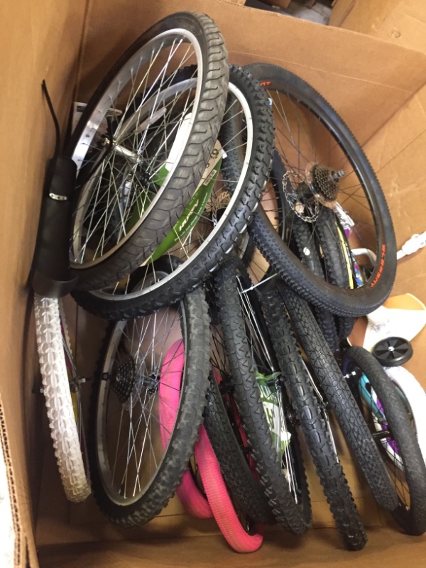 Photo 1 of 17 ASSORTED BIKE TIRES AND WHEELS. MULTIPLE COLORS SIZES AND STYLES. A COUPLE HANDLE BARS. SOME NEW SOME USED. SOME DAMAGED SOME NOT 