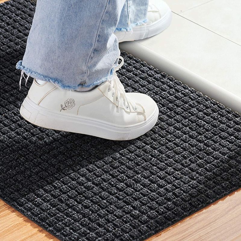 Photo 1 of Black Doormat,Durable Rubber-Backed Doormat,Ridged Pattern Good for Scraping Shoes Front Door Mat,Vacuums Clean Easily,Waterproof Entry Mat ,Rubber Door Mats Outdoor Unrolled Perfectly Flat 34.5*22.5 inch 
