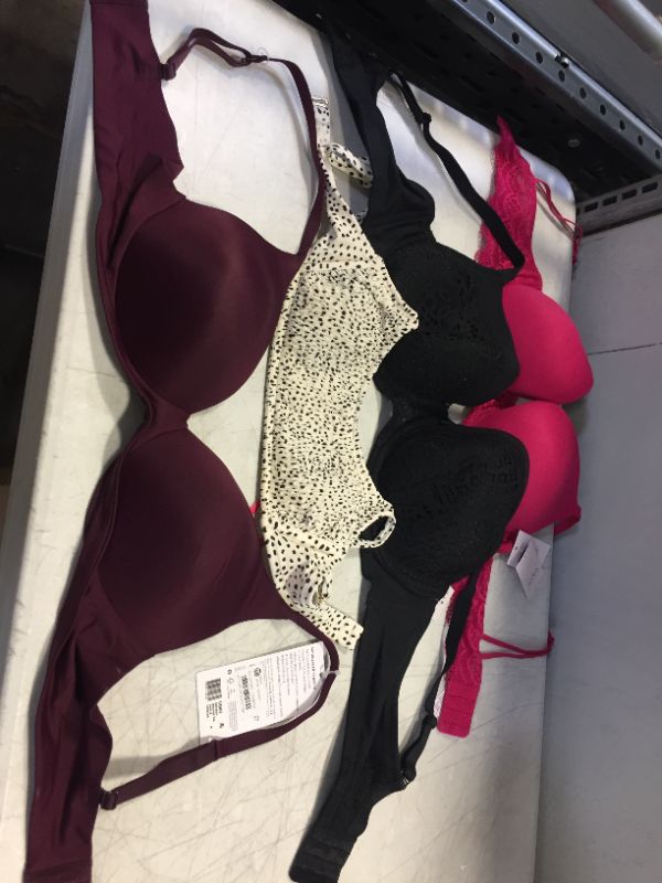 Photo 1 of 4 PACK OF BRAS DIFFERENT SIZES 
PINK - 36C
BLACK - 42D
SWIM SUIT TOP - SMALL
PURPLE - LARGE 