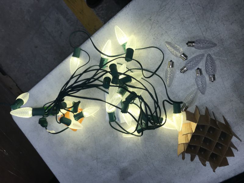 Photo 1 of C9 Christmas Lights Outdoor LED String Lights 25 Feet with 25 Faceted Strawberry Lighting (1 Spare Bulb) Extendable UL Certified for Holiday Indoor and Outdoor Christmas Decorations Warm White AND 16 REPLACEMENT BULBS
