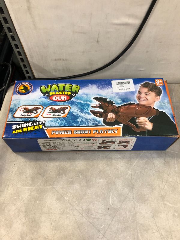 Photo 1 of KIDS DINOSAUR WATER GUN 