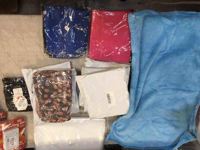 Photo 1 of 10 pack of women's clothing and one blanket, 5 pairs of waist trainer tummy tuckers, 4 size medium and 1 XL and one pair of small close toed leggings, one small toddler blanket and 3 scarves