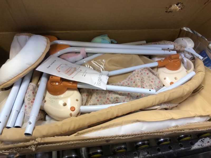 Photo 2 of BABY SWINGING BASSINET (MAJOR DAMAGES TO BOX)