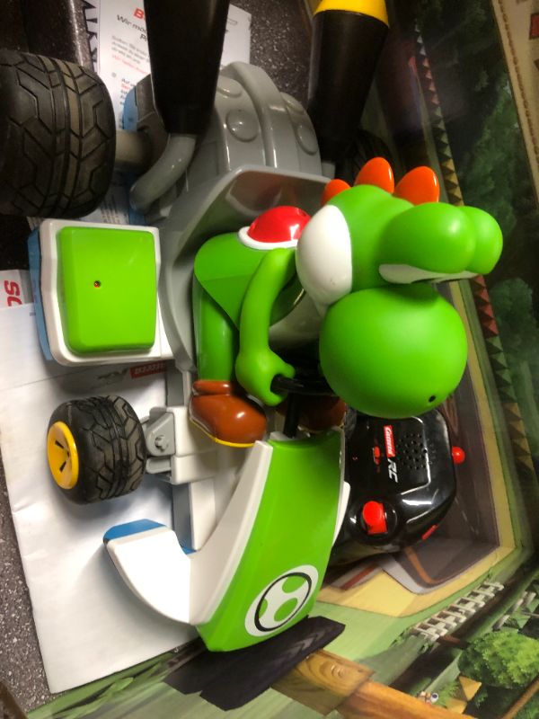 Photo 2 of Nintendo Mario Kart 1:16 Scale RC Car - Yoshi (WORKS FOR LITTLE THEN STOPS, DIRT ON ITEM INDICATE PRIOR USE)