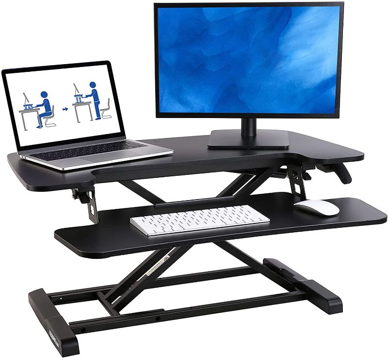 Photo 1 of NEW, DAMAGED BOX. FLEXISPOT 32 inch Standing Desk Converter | Height Adjustable Stand Up Desk Riser, Black Home Office Desk Workstation for Dual Monitors and Laptop M732 - Product Dimensions	23.7"D x 31.5"W x 19.7"H
