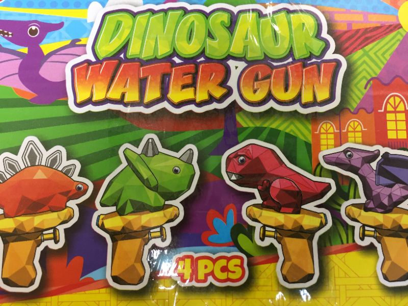 Photo 1 of 4 pc dinosaur watergun-- stegosaurus 