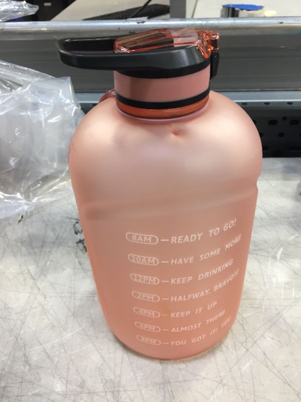 Photo 1 of 120 oz water bottle pink peachy color 