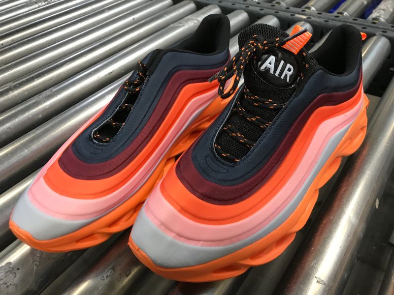 Photo 1 of CASE OF 13 ORANGE STRIPED RUNNING SHOES WITH FOAM BOTTOMS 