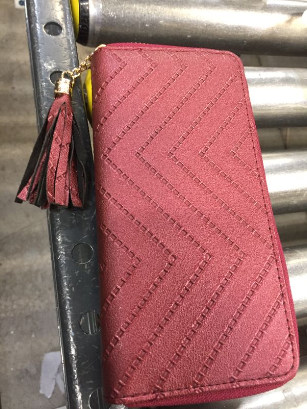 Photo 1 of LEATHER CLUTCH WALLET. 