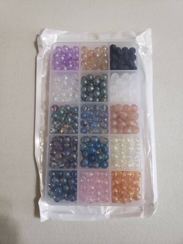 Photo 1 of ASSORTED GLASS BEAD KIT FOR CRAFTING.