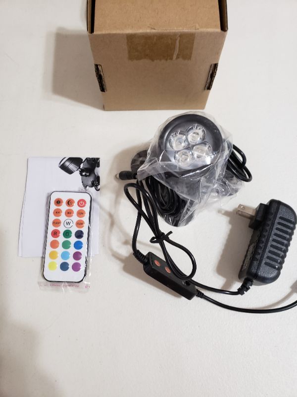 Photo 1 of LED MINI SPOTLIGHT WITH REMOTE, MULTI-COLORED.